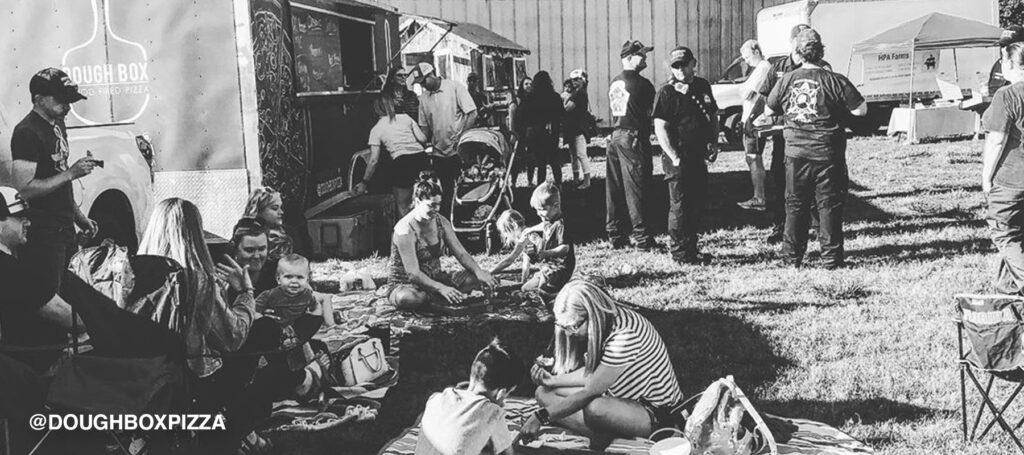 Food truck park full of families