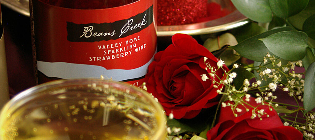 Beans Creek Valley Home Sparkling Strawberry Wine bottle with roses