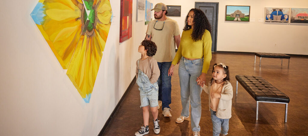 Family looking at art in gallery
