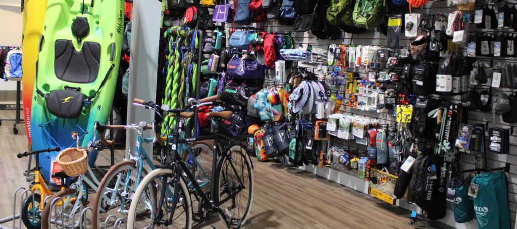store with outdoor gear, bikes, and kayaks