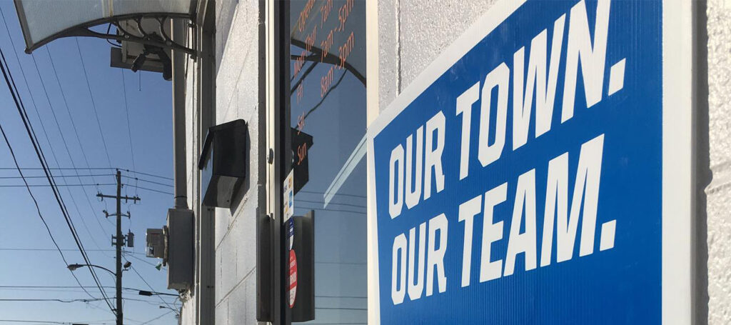 A sign that reads 'Our town. Our Team'